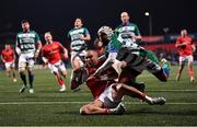 25 March 2022; Simon Zebo of Munster is tackled by Rhyno Smith of Benetton as he scores his side's third try during the United Rugby Championship match between Munster and Benetton at Musgrave Park in Cork. Photo by Piaras Ó Mídheach/Sportsfile