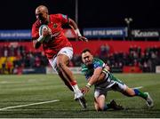 25 March 2022; Simon Zebo of Munster gets past Dewaldt Duvenage of Benetton on his way to scoring his side's third try during the United Rugby Championship match between Munster and Benetton at Musgrave Park in Cork. Photo by Piaras Ó Mídheach/Sportsfile