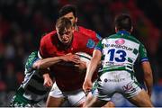 25 March 2022; Gavin Coombes of Munster is tackled by Giacomo Da Re of Benetton, left, during the United Rugby Championship match between Munster and Benetton at Musgrave Park in Cork. Photo by Piaras Ó Mídheach/Sportsfile