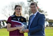 26 March 2022; Player of the match Ellie Brady of Loreto College Cavan is presented her award by Uachtarán Cumann Peil Gael na mBan, Mícheál Naughton during the Lidl All Ireland Post Primary School Junior 'A' Championship Final match between Loreto College, Cavan, and Sacred Heart, Mayo, at Curry GAA club in Sligo. Photo by Harry Murphy/Sportsfile