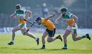 26 March 2022; Ciarán Clarke of Antrim in action against Brian Duignan of Offaly during the Allianz Hurling League Division 1 Relegation Play-off match between Antrim and Offaly at Páirc Tailteann in Navan, Meath. Photo by Daire Brennan/Sportsfile