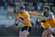26 March 2022; Ciarán Clarke of Antrim in action against Jack Screeney of Offaly during the Allianz Hurling League Division 1 Relegation Play-off match between Antrim and Offaly at Páirc Tailteann in Navan, Meath. Photo by Daire Brennan/Sportsfile