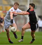 20 March 2022; John Cooper of Cork is tackled by Conor Poland of Down during the Allianz Football League Division 2 match between Cork and Down at Páirc Uí Chaoimh in Cork. Photo by Brendan Moran/Sportsfile