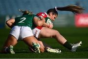 26 March 2022; Kayleigh Powell of Wales is tackled by Neve Jones of Ireland during the TikTok Women's Six Nations Rugby Championship match between Ireland and Wales at RDS Arena in Dublin. Photo by David Fitzgerald/Sportsfile