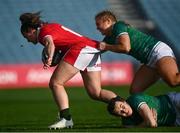 26 March 2022; Kayleigh Powell of Wales is tackled by Neve Jones, top, and Eve Higgins of Ireland during the TikTok Women's Six Nations Rugby Championship match between Ireland and Wales at RDS Arena in Dublin. Photo by David Fitzgerald/Sportsfile