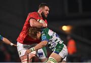 25 March 2022; Jason Jenkins of Munster is tackled by Andries Coetzee of Benetton during the United Rugby Championship match between Munster and Benetton at Musgrave Park in Cork. Photo by Piaras Ó Mídheach/Sportsfile