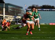 26 March 2022; Amee-Leigh Murphy Crowe of Ireland on her way to scoring her side's first try despite the attempted tackle from Lisa Neumann of Wales during the TikTok Women's Six Nations Rugby Championship match between Ireland and Wales at RDS Arena in Dublin. Photo by David Fitzgerald/Sportsfile