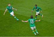 26 March 2022; Chiedozie Ogbene of Republic of Ireland celebrates with James McClean and Jeff Hendrick after scoring his side's first goal during the international friendly match between Republic of Ireland and Belgium at the Aviva Stadium in Dublin. Photo by Seb Daly/Sportsfile