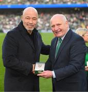 26 March 2022; FAI President Gerry McAnaney, right, makes a presentation to former Republic of Ireland player Paul McGrath at half-time of the international friendly match between Republic of Ireland and Belgium at the Aviva Stadium in Dublin. Photo by Stephen McCarthy/Sportsfile