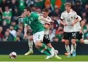 26 March 2022; Seamus Coleman of Republic of Ireland in action against Thorgan Hazard of Belgium during the international friendly match between Republic of Ireland and Belgium at the Aviva Stadium in Dublin. Photo by Michael P Ryan/Sportsfile