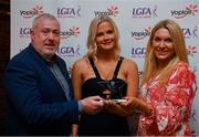 26 March 2022; Ciara McCarthy of University College Cork  receives her Yoplait HEC All Star 2022 award from Deirdre Lowry, Brand Manager Yoplait Ireland, and Daniel Caldwell, Chairperson Ladies HEC, at the 2022 Yoplait HEC All Stars evening, at the Croke Park Hotel, Dublin. Photo by Ray McManus/Sportsfile