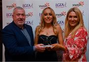 26 March 2022; Isobel Sheehan of University College Cork  receives her Yoplait HEC All Star 2022 award from Deirdre Lowry, Brand Manager Yoplait Ireland, and Daniel Caldwell, Chairperson Ladies HEC, at the 2022 Yoplait HEC All Stars evening, at the Croke Park Hotel, Dublin. Photo by Ray McManus/Sportsfile