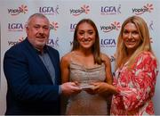 26 March 2022; Sarah Leahy of University College Cork receives her Yoplait HEC All Star 2022 award from Deirdre Lowry, Brand Manager Yoplait Ireland, and Daniel Caldwell, Chairperson Ladies HEC, at the 2022 Yoplait HEC All Stars evening, at the Croke Park Hotel, Dublin. Photo by Ray McManus/Sportsfile