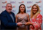26 March 2022; Megan Ryan of Mary Immaculate College, Limerick, receives her Yoplait HEC All Star 2022 award from Deirdre Lowry, Brand Manager Yoplait Ireland, and Daniel Caldwell, Chairperson Ladies HEC, at the 2022 Yoplait HEC All Stars evening, at the Croke Park Hotel, Dublin. Photo by Ray McManus/Sportsfile