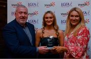26 March 2022; Iris Kennelly of TUS Midwest receives her Yoplait Rising Stars 2022 award from Deirdre Lowry, Brand Manager Yoplait Ireland, and Daniel Caldwell, Chairperson Ladies HEC, at the 2022 Yoplait HEC All Stars evening, at the Croke Park Hotel, Dublin. Photo by Ray McManus/Sportsfile