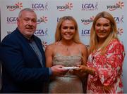 26 March 2022; Katie Quirke of University College Cork receives her Yoplait HEC All Star 2022 award from Deirdre Lowry, Brand Manager Yoplait Ireland, and Daniel Caldwell, Chairperson Ladies HEC, at the 2022 Yoplait HEC All Stars evening, at the Croke Park Hotel, Dublin. Photo by Ray McManus/Sportsfile