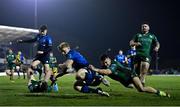 26 March 2022; Tommy O'Brien of Leinster scores his side's seventh try despite the tackle of Tiernan O'Halloran of Connacht during the United Rugby Championship match between Connacht and Leinster at the Sportsground in Galway. Photo by Harry Murphy/Sportsfile