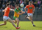 27 March 2022; Ryan McHugh of Donegal in action against Jarly Og Burns of Armagh during the Allianz Football League Division 1 match between Donegal and Armagh at O'Donnell Park in Letterkenny, Donegal. Photo by Oliver McVeigh/Sportsfile
