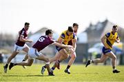 27 March 2022; Ultan Harney of Roscommon in action against Matthew Tierney, left, and Johnny Heaney of Galway during the Allianz Football League Division 2 match between Roscommon and Galway at Dr Hyde Park in Roscommon. Photo by David Fitzgerald/Sportsfile