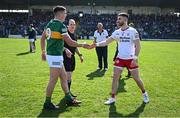 27 March 2022; Team captains Joe O'Connor of Kerry, left, and Padraig Hampsey of Tyrone shake hands in the company of referee David Coldrick before the Allianz Football League Division 1 match between Kerry and Tyrone at Fitzgerald Stadium in Killarney, Kerry. Photo by Brendan Moran/Sportsfile