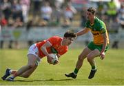 27 March 2022; Ben Crealey of Armagh in action against Caolan Ward of Donegal during the Allianz Football League Division 1 match between Donegal and Armagh at O'Donnell Park in Letterkenny, Donegal. Photo by Oliver McVeigh/Sportsfile