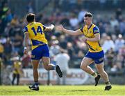 27 March 2022; Cian McKeon of Roscommon, right, celebrates with teammate Donie Smith after he scored their side's first goal during the Allianz Football League Division 2 match between Roscommon and Galway at Dr Hyde Park in Roscommon. Photo by David Fitzgerald/Sportsfile