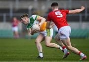 27 March 2022; Johnny Moloney of Offaly in action against John Cooper of Cork during the Allianz Football League Division 2 match between Offaly and Cork at Bord na Mona O'Connor Park in Tullamore, Offaly. Photo by Sam Barnes/Sportsfile