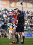 27 March 2022; Kevin Flahive of Cork is shown a black card by referee Niall Cullen during the Allianz Football League Division 2 match between Offaly and Cork at Bord na Mona O'Connor Park in Tullamore, Offaly. Photo by Sam Barnes/Sportsfile