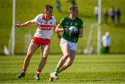 27 March 2022; Bryan Menton of Meath in action against Shane McGuigan of Derry during the Allianz Football League Division 2 match between Meath and Derry at Páirc Táilteann in Navan, Meath. Photo by Philip Fitzpatrick/Sportsfile