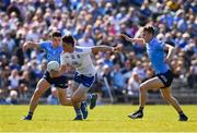 27 March 2022; Gary Mohan of Monaghan in action against David Byrne, left, and Tom Lahiff of Dublin during the Allianz Football League Division 1 match between Monaghan and Dublin at St Tiernach's Park in Clones, Monaghan. Photo by Ray McManus/Sportsfile