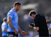 27 March 2022; Referee Noel Mooney notes the name of James McCarthy of Dublin before issuing him a yellow card during the Allianz Football League Division 1 match between Monaghan and Dublin at St Tiernach's Park in Clones, Monaghan. Photo by Ray McManus/Sportsfile