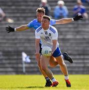 27 March 2022; x Conor McCarthy of Monaghan scores a point under pressure fronm Jonny Cooper of Dublin during the Allianz Football League Division 1 match between Monaghan and Dublin at St Tiernach's Park in Clones, Monaghan. Photo by Ray McManus/Sportsfile
