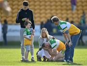27 March 2022; Anton Sullivan of Offaly is consoled by friends and family after his side's defeat in the Allianz Football League Division 2 match between Offaly and Cork at Bord na Mona O'Connor Park in Tullamore, Offaly. Photo by Sam Barnes/Sportsfile