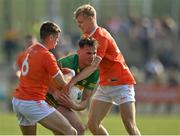 27 March 2022; Jason McGee of Donegal in action against Greg McCabe and Cian McConville of Armagh during the Allianz Football League Division 1 match between Donegal and Armagh at O'Donnell Park in Letterkenny, Donegal. Photo by Oliver McVeigh/Sportsfile