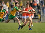 27 March 2022; Rian O'Neill of Armagh in action against Michael Langan of Donegal during the Allianz Football League Division 1 match between Donegal and Armagh at O'Donnell Park in Letterkenny, Donegal. Photo by Oliver McVeigh/Sportsfile