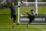 28 March 2022; Scott Hogan has a shot saved by goalkeeper James Talbot during a Republic of Ireland training session at FAI National Training Centre in Dublin. Photo by Eóin Noonan/Sportsfile