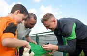 28 March 2022; Goalkeeper James Talbot signs autographs for players from Mourne Celtic, Drimnagh, after a Republic of Ireland training session at FAI National Training Centre in Dublin. Photo by Eóin Noonan/Sportsfile