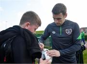 28 March 2022; Seamus Coleman signs autographs for players from Mourne Celtic, Drimnagh, after a Republic of Ireland training session at FAI National Training Centre in Dublin. Photo by Eóin Noonan/Sportsfile