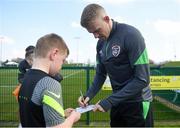 28 March 2022; James McClean signs autographs for players from Mourne Celtic, Drimnagh, after a Republic of Ireland training session at FAI National Training Centre in Dublin. Photo by Eóin Noonan/Sportsfile
