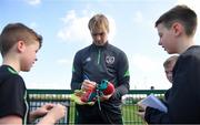 28 March 2022; Goalkeeper Caoimhin Kelleher signs autographs for players from Mourne Celtic, Drimnagh, after a Republic of Ireland training session at FAI National Training Centre in Dublin. Photo by Eóin Noonan/Sportsfile