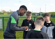 28 March 2022; Chiedozie Ogbene signs autographs for players from Mourne Celtic, Drimnagh, after a Republic of Ireland training session at FAI National Training Centre in Dublin. Photo by Eóin Noonan/Sportsfile