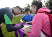 28 March 2022; Shane Duffy signs autographs for players from Mourne Celtic, Drimnagh, after a Republic of Ireland training session at FAI National Training Centre in Dublin. Photo by Eóin Noonan/Sportsfile