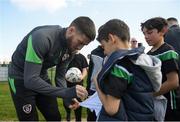 28 March 2022; Matt Doherty signs autographs for players from Mourne Celtic, Drimnagh, after a Republic of Ireland training session at FAI National Training Centre in Dublin. Photo by Eóin Noonan/Sportsfile