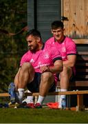 28 March 2022; Rónan Kelleher puts on his boots as Dan Sheehan looks on during a Leinster Rugby squad training session at UCD in Dublin. Photo by Harry Murphy/Sportsfile