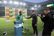 26 March 2022; Chiedozie Ogbene of Republic of Ireland is inrerviewed by Kieran Crowley, FAI communications executive, and Matthew Turnbull, FAI videographer, after the international friendly match between Republic of Ireland and Belgium at the Aviva Stadium in Dublin. Photo by Stephen McCarthy/Sportsfile