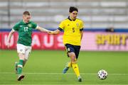 29 March 2022; Eric Kahl of Sweden in action against Ross Tierney of Republic of Ireland during the UEFA European U21 Championship Qualifier match between Republic of Ireland and Sweden at Borås Arena in Sweden. Photo by Jörgen Jarnberger/Sportsfile