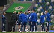 29 March 2022; Northern Ireland players walk the pitch before the international friendly match between Northern Ireland and Hungary at National Football Stadium at Windsor Park in Belfast. Photo by Ramsey Cardy/Sportsfile