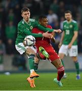 29 March 2022; Gavin Whyte of Northern Ireland in action against Loïc Négo of Hungary during the international friendly match between Northern Ireland and Hungary at National Football Stadium at Windsor Park in Belfast. Photo by Ramsey Cardy/Sportsfile