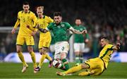 29 March 2022; Ryan Manning of Republic of Ireland is tackled by Rolandas Baravykas of Lithuania during the international friendly match between Republic of Ireland and Lithuania at the Aviva Stadium in Dublin. Photo by Ben McShane/Sportsfile