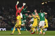 29 March 2022; Chiedozie Ogbene of Republic of Ireland in action against Lithuania goalkeeper Džiugas Bartkus during the international friendly match between Republic of Ireland and Lithuania at the Aviva Stadium in Dublin. Photo by Ben McShane/Sportsfile